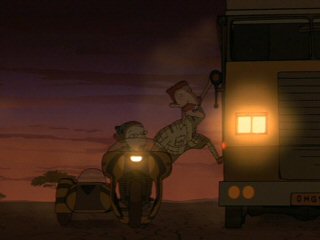 Eliza's dad Nigel (Tim Curry) getting off their motorbike (wife Marianne, voice of Jodi Carlisle, at the wheel) onto their mobile home, the "Commvee"
